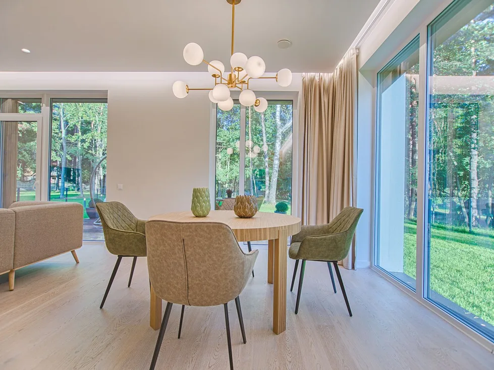 A light-filled dining room looking out to a garden