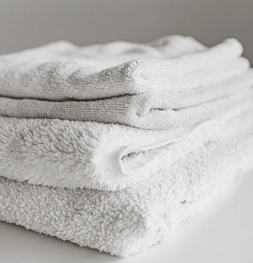 A stack of neatly folded white towels